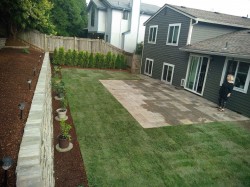 Paver patio, new sod, new two tiered retaining wall and beauty bark